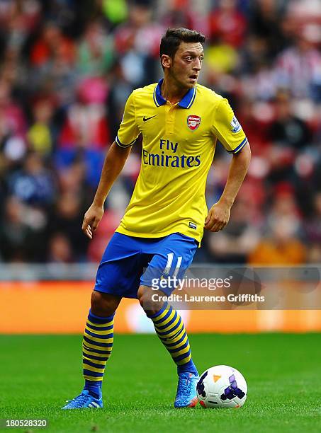 Mesut Oezil of Arsenal in action during the Barclays Premier League match between Sunderland and Arsenal at the Stadium of Light on September 14,...