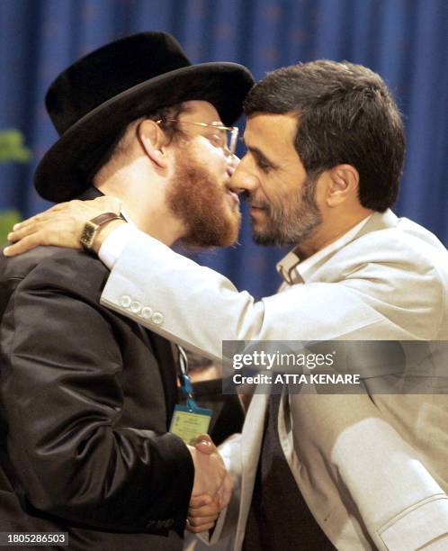 Iranian President Mahmoud Ahmedinajad embraces a member of Naturei Karta during a controversial conference aimed at breaking taboos on the Holocaust...