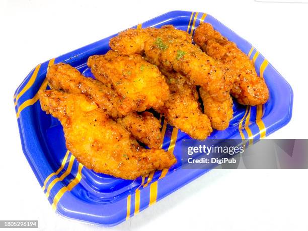 black pepper chicken in disposable plastic tray against white background - chicken strip stock pictures, royalty-free photos & images