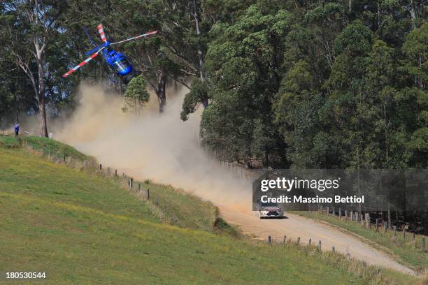 Mikko Hirvonen of Finland and Jarmo Lehtinen of Finland compete in their Citroen Total Abu Dhabi WRT Citroen DS3 WRC during Day Two of the WRC...