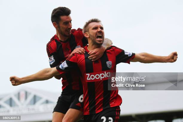 Gareth McAuley of West Bromwich Albion celebrates his goal with Liam Ridgewell during the Barclays Premier League match between Fulham and West...