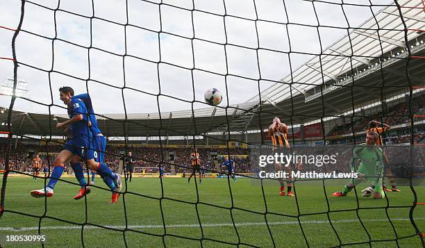 Goalkeeper Allan McGregor of Hull City looks dejected as Peter Whittingham of Cardiff City celebrates scoring their first goal during the Barclays...