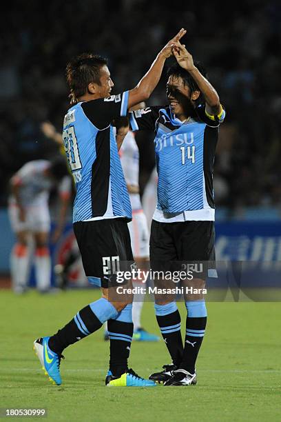 Kengo Nakamura of Kawasaki Frontale celebrates the second goal with Junichi Inamoto during the J.League match between Kawasaki Frontale and Sanfrecce...