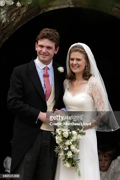 James Meade and Lady Laura Marsham pose for photographs after their wedding at St Nicholas' Church in Gayton on September 14, 2013 in King's Lynn,...
