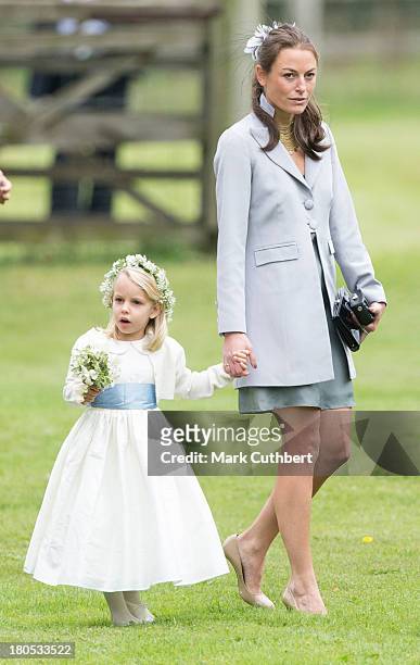 Jecca Craig attends the wedding of James Meade and Lady Laura Marsham at The Parish Church of St. Nicholas in Gaytonon September 14, 2013 in King's...