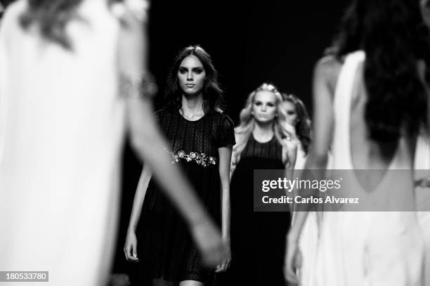 Models showcase designs by Teresa Helbig on the runway at Teresa Helbig show during Mercedes Benz Fashion Week Madrid Spring/Summer 2014 at Ifema on...