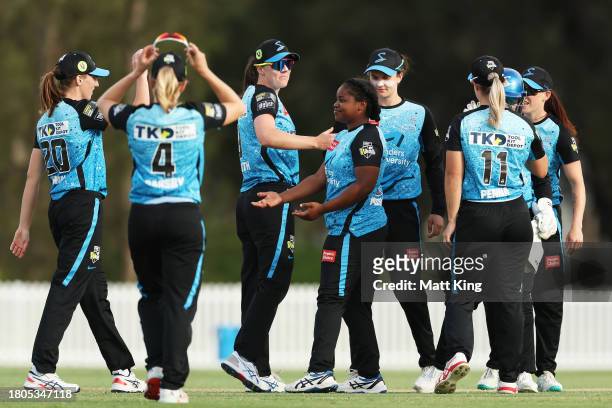 Anesu Mushangwe of the Strikers celebrates victory with team mates after bowling the final over during the WBBL match between Sydney Thunder and...