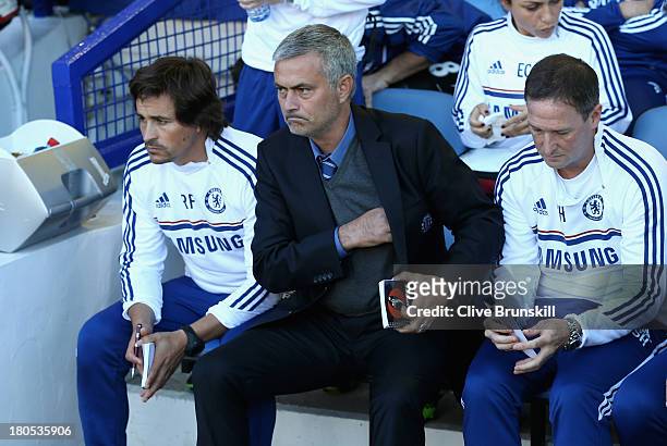 Chelsea Manager Jose Mourinho looks on with Assistants Rui Faria and Steve Holland prior to the Barclays Premier League match between Everton and...