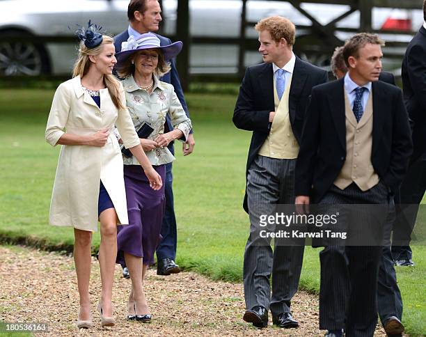Prince Harry attends the wedding of James Meade and Lady Laura Marsham at The Parish Church of St. Nicholas in Gayton on September 14, 2013 in King's...