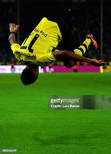 Pierre Aubameyang of Dortmund celebrates after scoring his teams third goal during the Bundesliga match between Borussia Dortmund and Hamburger SV at...