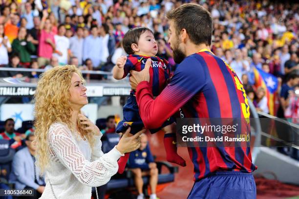 Shakira and Gerard Pique of FC Barcelona are seen with their son Milan prior to the La Liga match between FC Barcelona and Sevilla FC at Camp Nou on...