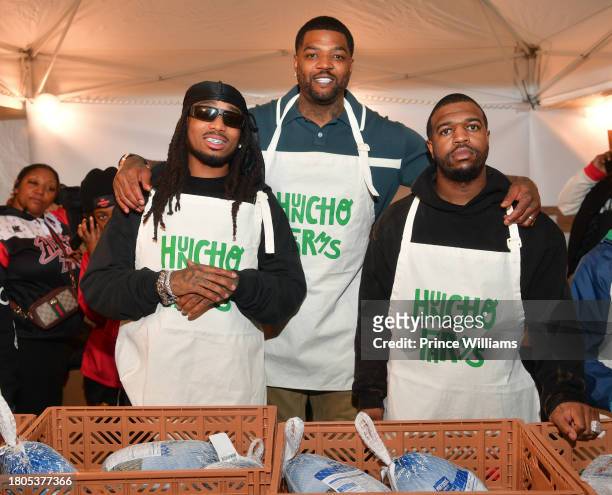 Quavo, Josh Smith and Rel attend "Huncho Farms" hosted by Quavo Cares & Urban Recipe in Atlanta Community ahead of Thanksgiving on November 20, 2023...