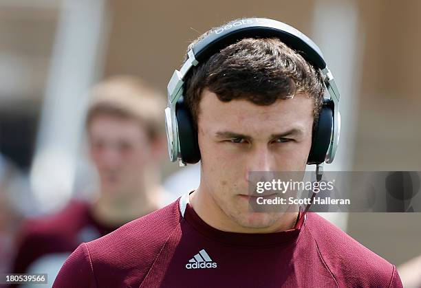 Johnny Manziel of Texas A&M Aggies walks to the field before the start of the game against the Alabama Crimson Tide at Kyle Field on September 14,...