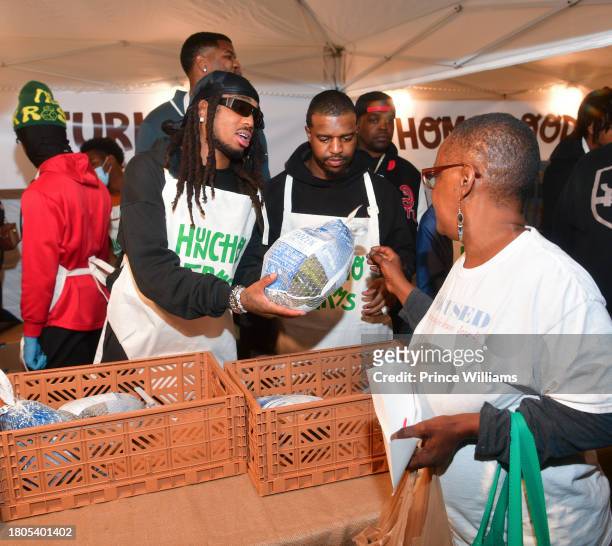 Quavo hands out turkeys during "Huncho Farms" hosted by Quavo Cares & Urban Recipe in Atlanta Community ahead of Thanksgiving on November 20, 2023 in...