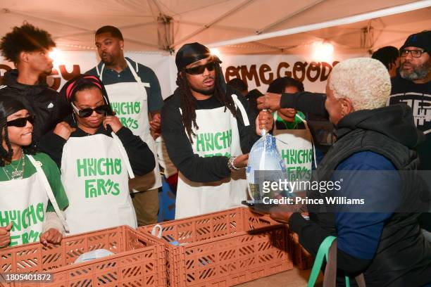 Quavo hands out turkeys during "Huncho Farms" hosted by Quavo Cares & Urban Recipe in Atlanta Community ahead of Thanksgiving on November 20, 2023 in...