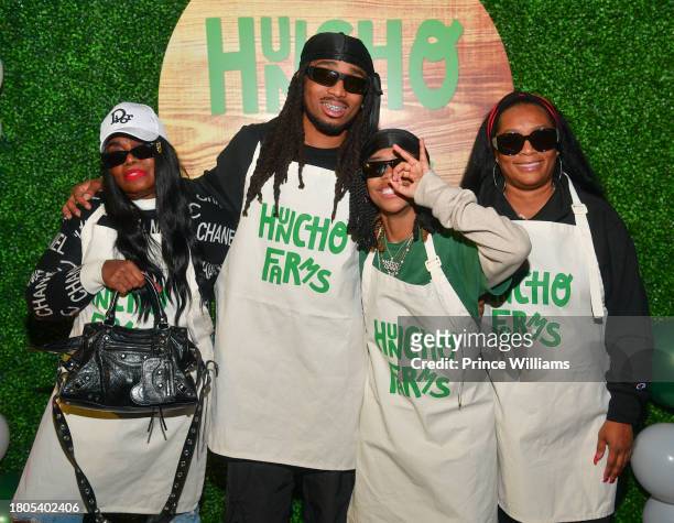 Edna Marshall, Quavo and Titania Davenport attend "Huncho Farms" hosted by Quavo Cares & Urban Recipe in Atlanta Community ahead of Thanksgiving on...