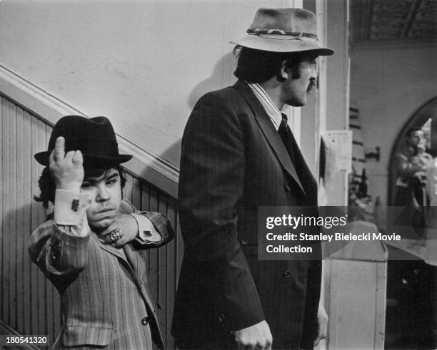 Actors Herve Villechaize and Joe Santos, in a scene from the movie 'The Gang That Couldn't Shoot Straight', 1971.