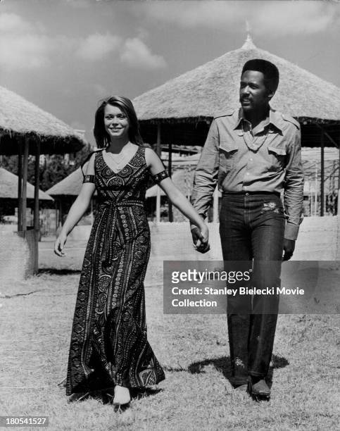 Candid promotional shot of actors Richard Roundtree and Neda Arneric, as they appear in the movie 'Shaft in Africa', 1973.