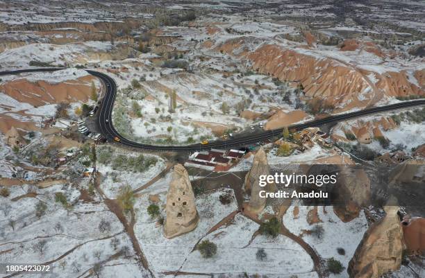 An aerial view of the snow covered fairy chimneys after snowfall in Cappadocia, which is preserved as a UNESCO World Heritage site and is famous for...