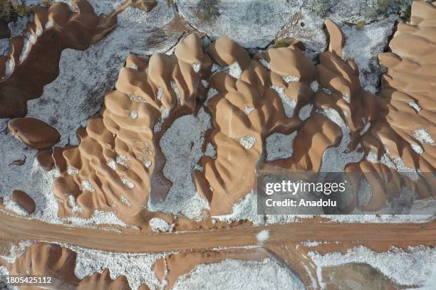 An aerial view of the snow covered fairy chimneys after snowfall in Cappadocia, which is preserved as a UNESCO World Heritage site and is famous for...