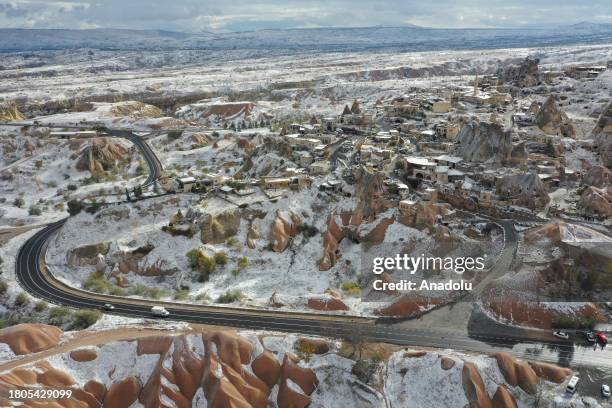 An aerial view of the snow covered fairy chimneys after snowfall in Cappadocia, which is preserved as a UNESCO World Heritage site and is famous for...