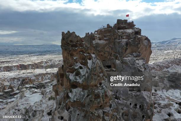 An aerial view of the snow covered fairy chimneys after snowfall in Cappadocia, which is preserved as a UNESCO World Heritage site and is famous for...