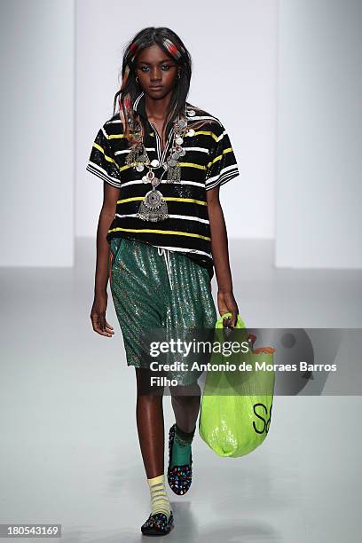 Model walks the runway at the Ashish show during London Fashion Week SS14 at BFC Courtyard Showspace on September 14, 2013 in London, England.