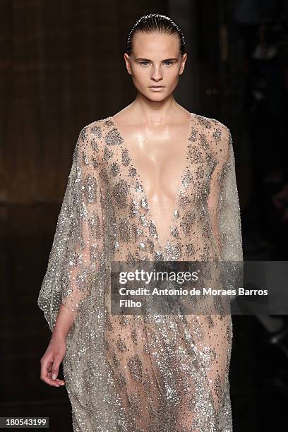 Model walks the runway at the Julien Macdonald show during London Fashion Week SS14 on September 14, 2013 in London, England.