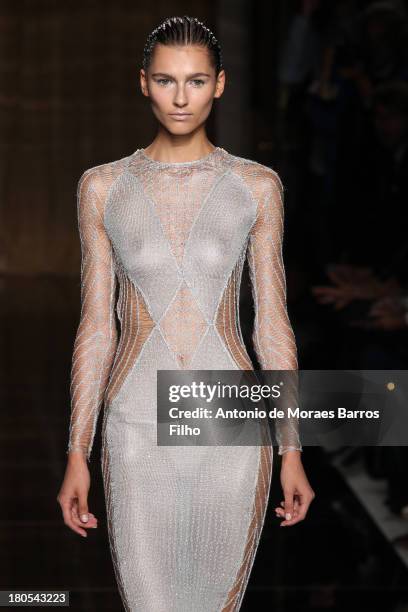 Model walks the runway at the Julien Macdonald show during London Fashion Week SS14 on September 14, 2013 in London, England.