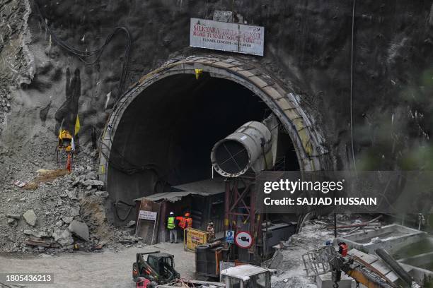 Rescue personnel work at the collapsed under construction Silkyara tunnel in the Uttarkashi district of India's Uttarakhand state, on November 27,...