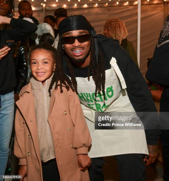 Quavo poses with a guest during "Huncho Farms" hosted by Quavo Cares & Urban Recipe in Atlanta Community ahead of Thanksgiving on November 20, 2023...