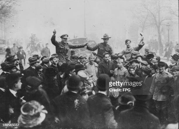French, American and British troops celebrating Armistice Day in France, November 11th 1918.