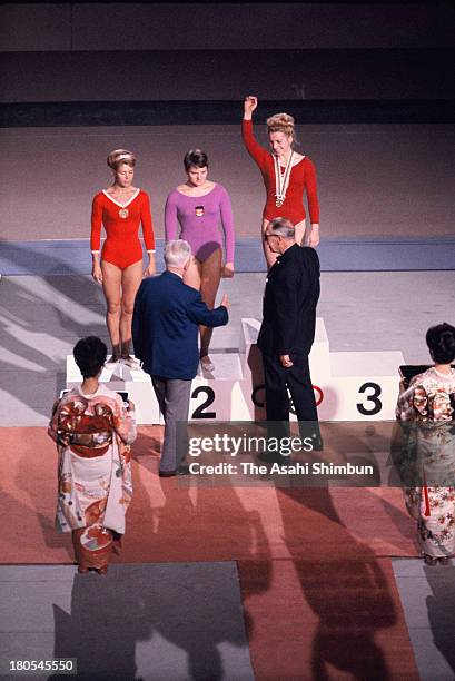 Gold Medalist Vera Caslavska of Czechoslovakia, Silver Medalists Larysa Latynina of Soviet Union and Birgit Radochla of Germany on the podium during...