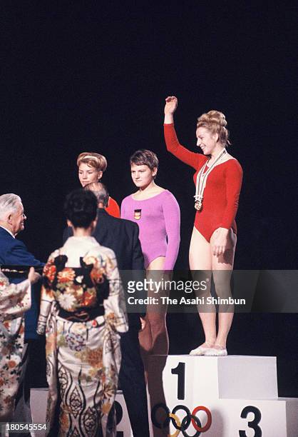 Gold Medalist Vera Caslavska of Czechoslovakia, Silver Medalists Larysa Latynina of Soviet Union and Birgit Radochla of Germany on the podium during...