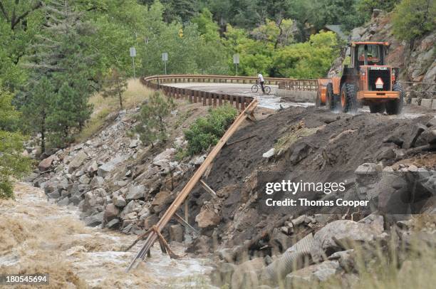 Colorado Dept of Transportation works to clear debris from Boulder Canyon, flooded due to heavy rains and swollen rivers on September 13, 2013 in...