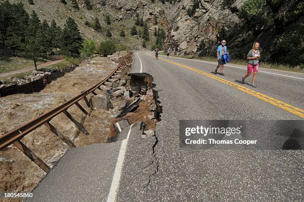 Boulder residents look over Boulder Canyon flooded due to heavy rains and swollen rivers on September 13, 2013 in Boulder, Colorado. The historic...