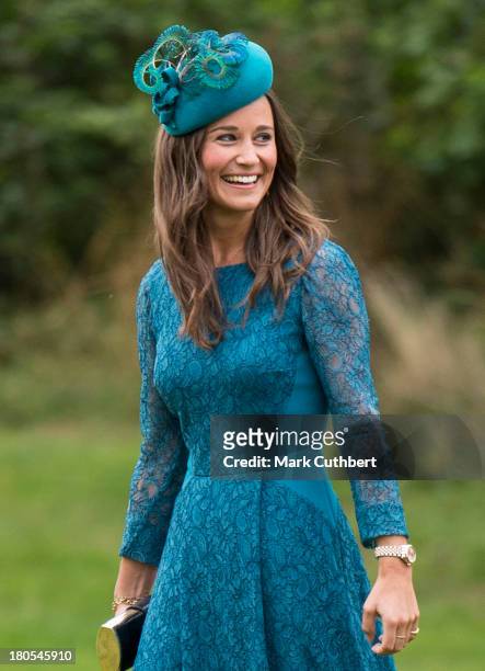 Pippa Middleton attends the wedding of James Meade and Lady Laura Marsham at The Parish Church of St. Nicholas in Gayton on September 14, 2013 in...