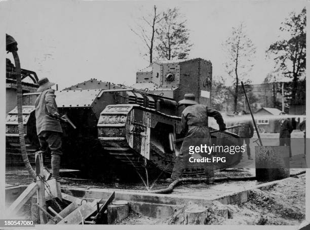 British forces on the western front, washing down a whippet tank, France, circa 1914-1918.