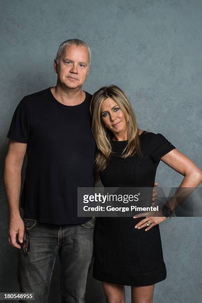 Actor Tim Robbins and actress/producer Jennifer Aniston of 'Life of Crime' pose at the Guess Portrait Studio during 2013 Toronto International Film...