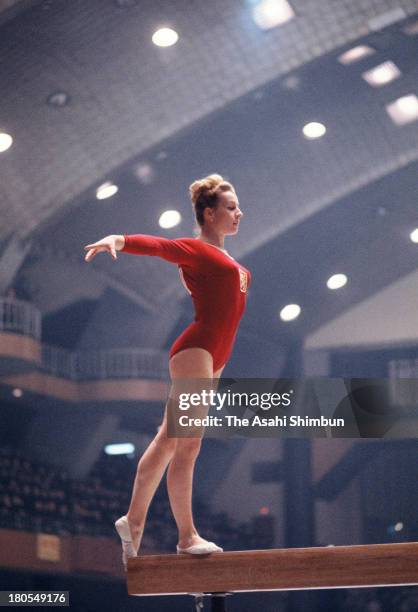 Vera Caslavska of Czechoslovakia competes in the Balance Beam of the Women's Artistic Gymnastics Individual All-Around during the Tokyo Olympics at...