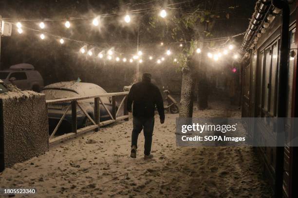 Man walks in a strong snowstorm along Sadovaya Street. Odessa weather forecasters believe that the current snowfall has become the heaviest in the...