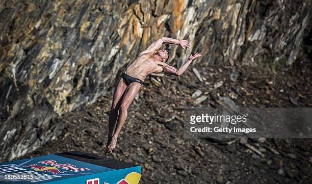 Artem Silchenko of Russia dives from the 27 metre platform at the Blue Lagoon during the sixth stop of the Red Bull Cliff Diving World Series on...