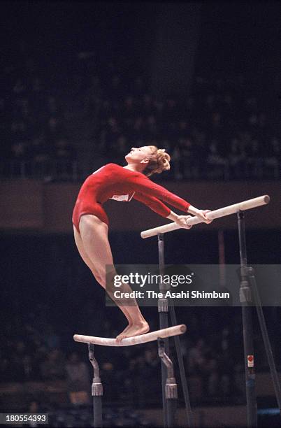 Vera Caslavska of Czechoslovakia competes in the Uneven Bars of the Women's Artistic Gymnastics Individual All-Around during the Tokyo Olympics at...