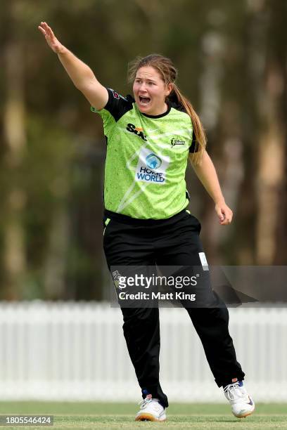 Hannah Darlington of the Thunder appeals successfully for the wicket of Madeline Penna of the Strikers during the WBBL match between Sydney Thunder...