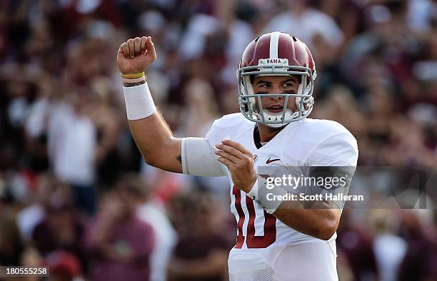 McCarron of the Alabama Crimson Tide celebrates a third quarter touchdown during the game against the Texas A&M Aggies at Kyle Field on September 14,...