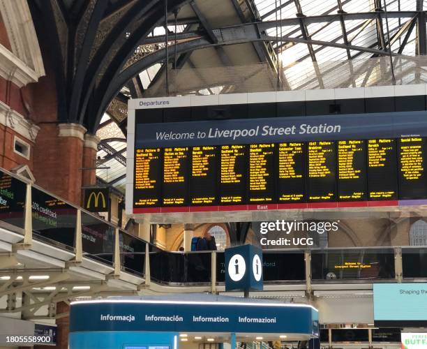 Information board with train departure times at Liverpool Street railway station, London, England.