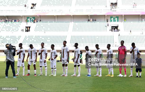 Players of Mali take part in the national anthem prior to the FIFA U-17 World Cup Round of 16 match between Mali and Mexico at Gelora Bung Tomo...