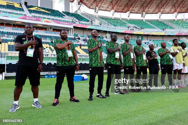 Soumaila Coulibaly, Head Coach of Mali, and his coaching staff participate in the national anthem prior to the FIFA U-17 World Cup Round of 16 match...
