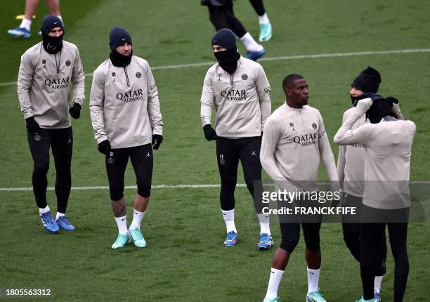 Paris Saint-Germain's players take part in a training session in Poissy, west of Paris, on November 27 on the eve of their UEFA Champions League...