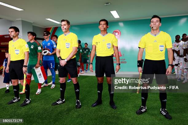 Referee Gustavo Tejera and Assistant Referees Carlos Barreiro, Ivo Nigel Mendez Chavez and Andres Nievas line up in the tunnel prior to the FIFA U-17...